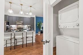 Atlanta apartment for rent - A kitchen with a white oven and a blue wall.