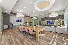 Duluth apartment for rent - A modern dining room with a wooden table and chairs.