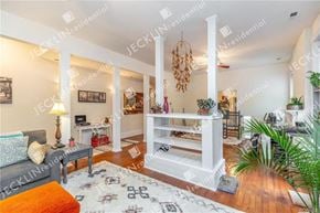 Richmond house for rent - A living room with a grey couch and a white coffee table.