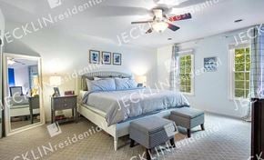 Henrico house for rent - a bedroom with a bed and a ceiling fan