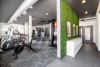 24-Hour cardio and strength training fitness center featuring peloton bike, hub training system, water rower, free weights and more!
