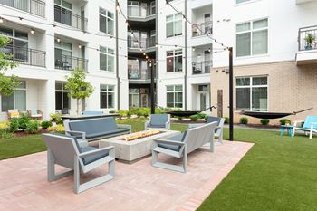 Grilling courtyard with hammock park, fire pit, and yard games