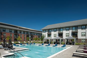 Resort-style pool with cabanas