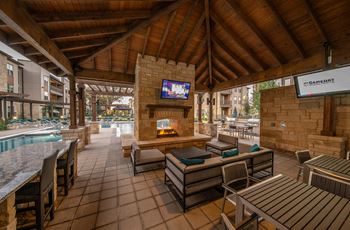 Poolside summerhouse with fireplace, tvs and comfy seating