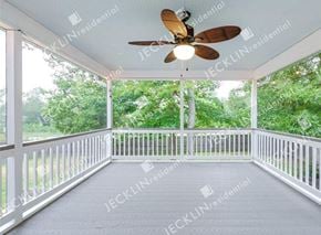 Henrico house for rent - A white porch with a ceiling fan and a view of trees.