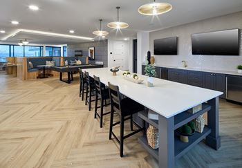 South building: sky lounge with remote work lounge, event kitchen, billiards table, and outdoor lounge with seating and fireplace