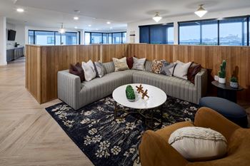 South building: sky lounge with remote work lounge, event kitchen, billiards table, and outdoor lounge with seating and fireplace