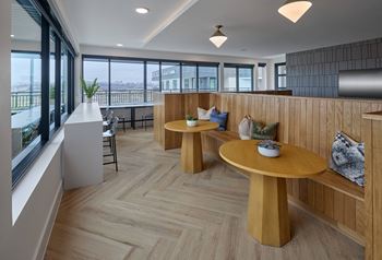 South building: sky lounge with remote work lounge, event kitchen, billiards table, and outdoor lounge with seating and fireplace