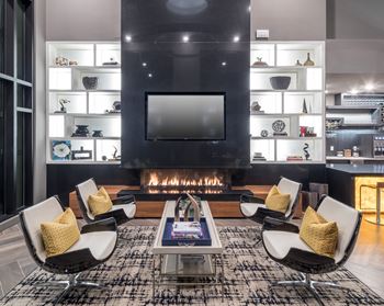 Resident lounge with fireplace and tv