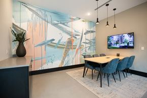 Atlanta apartment for rent - a dining room with a table and chairs and a tv on the wall