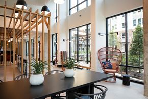 Atlanta apartment for rent - a dining room with a table and chairs and large windows