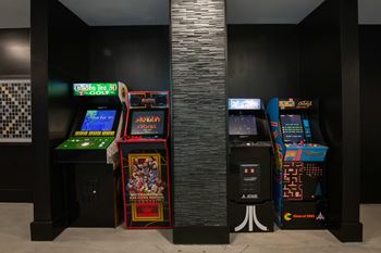 Gaming lounge with billiards, foosball, and vintage arcade games