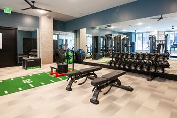 Cardio and strength training fitness center featuring echelon smart connect exercise bikes, hiit hub with trx suspension trainer, free weights