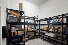 Nashville apartment for rent - A storage room with shelves filled with boxes and items.