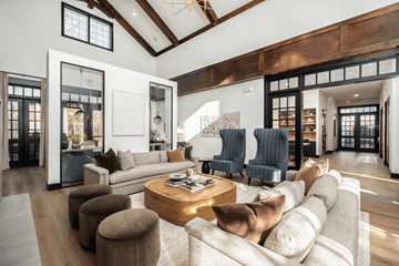 Charlotte townhouse for rent - A modern living room with a large couch and a coffee table.