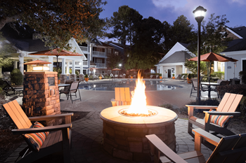 Poolside fire pit with cozy seating