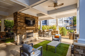 Summerhouse with fireplace, tv, and grills