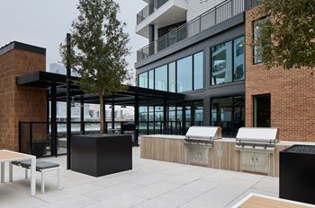 South building courtyards with grilling and picnic areas, yard games, hammock park, lounge areas, and fire pit with cozy seating