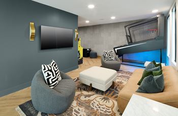 South building: gaming lounge with vintage arcade machines, skee-ball, and basketball arcade game