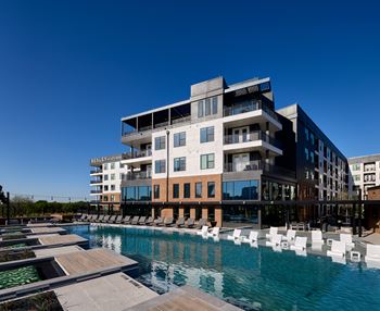 South building:  swimming pool with tanning shelf, overwater nets, and spectacular downtown views