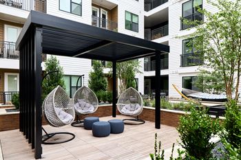 South building courtyards with grilling and picnic areas, yard games, hammock park, lounge areas, and fire pit with cozy seating