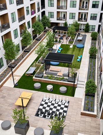 South building courtyards with grilling and picnic areas, yard games, hammock park, lounge areas, and fire pit with cozy seating