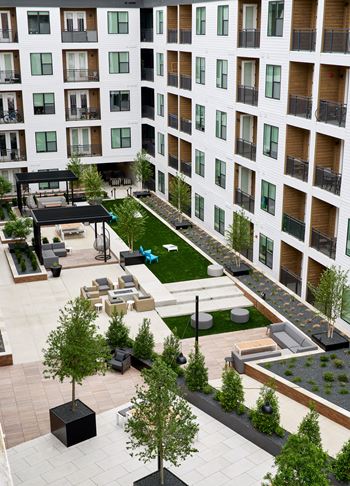 South building courtyards with grilling and picnic areas, yard games, hammock park, lounge areas, and fire pit with cozy seating