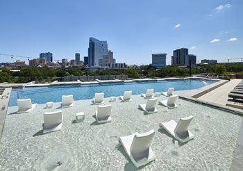 South building:  swimming pool with tanning shelf, overwater nets, and spectacular downtown views