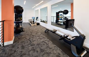 North building: 24-hour cardio & strength training fitness center with peloton bike, peloton row, pilates reformer, trx training equipment, yoga and stretching area, with outdoor fitness center