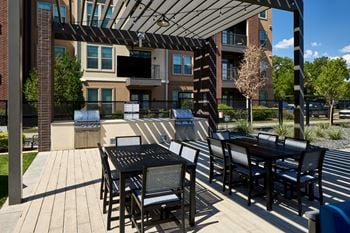 Poolside pavilion with bbq grills and picnic area