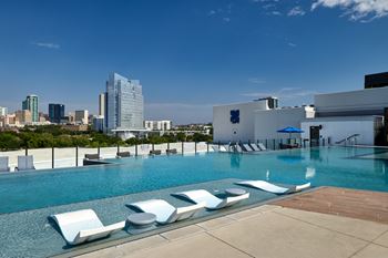 North building: rooftop infinity edge pool with outdoor lounge, cabanas and jumbotron