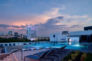 North building: rooftop infinity edge pool with outdoor lounge, cabanas and jumbotron