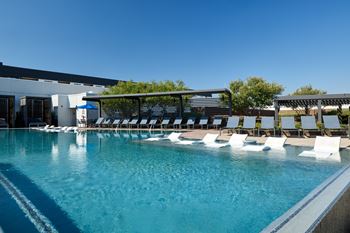 North building: rooftop infinity edge pool with outdoor lounge, cabanas and jumbotron