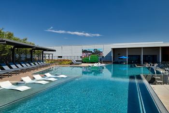 North building: rooftop infinity edge pool with outdoor lounge, cabanas and jumbotron