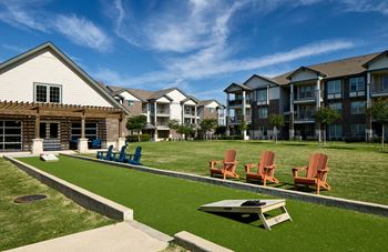 Outdoor game lounge with sand volleyball, bocce ball, corn hole and putting green