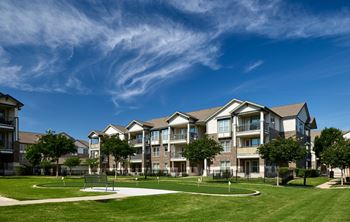 Outdoor game lounge with sand volleyball, bocce ball, corn hole and putting green