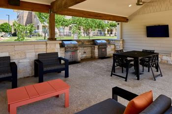 Poolside pavilion with bbq grills and picnic area