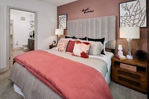 Fort Worth apartment for rent - A bedroom with a bed, nightstand, and lamp.