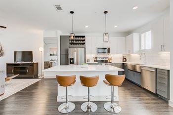 Gourmet kitchen with prep island and bar seating