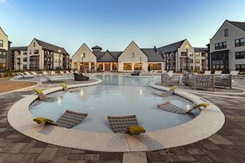Resort-style pool with tanning ledges