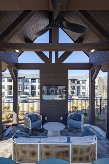 Summerhouse with grills, picnic tables, and tv