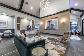 Cumming apartment for rent - a living room with couches and chairs and a large mirror
