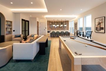 Chamblee apartment for rent - a living room with a pool table and a dining room