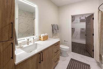 White marbled tile flooring in bathrooms (a)