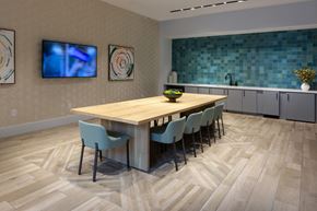 Chamblee apartment for rent - a dining room with a wooden table and chairs