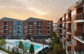 Nashville apartment for rent - Apartment complex with a pool in the foreground.