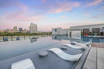 North building: rooftop infinity edge pool with outdoor lounge, cabanas and jumbotron
