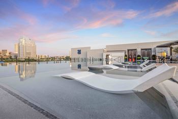 North building: rooftop infinity edge pool with outdoor lounge, cabanas and jumbotron