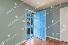 Henrico house for rent - A blue door is open to a hallway.