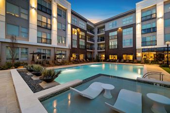 Resort-style pool with tanning ledge and private cabanas